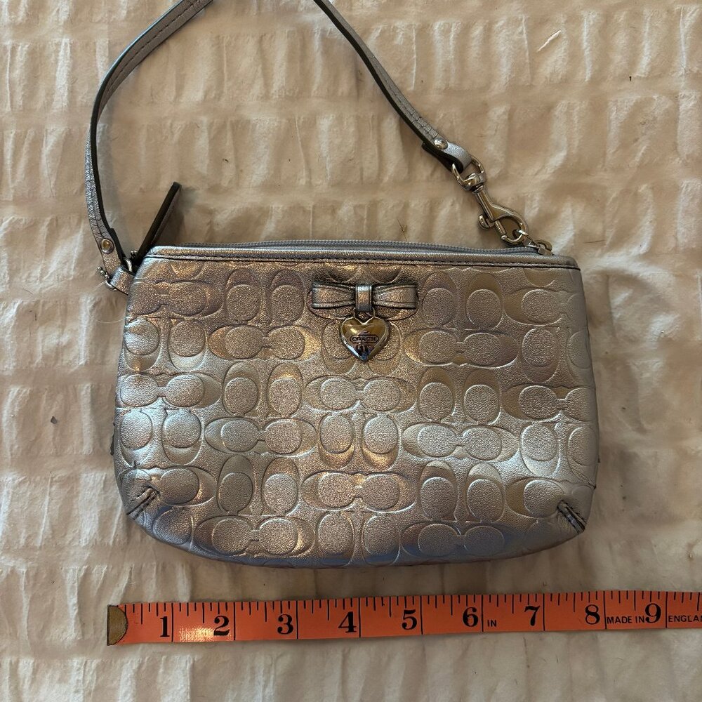 Authentic Coach Metallic Silver Wristlet with Heart Charm